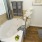 a bathroom with a tub and sink