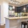a kitchen with a bar stools