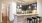 a kitchen with a bar stools