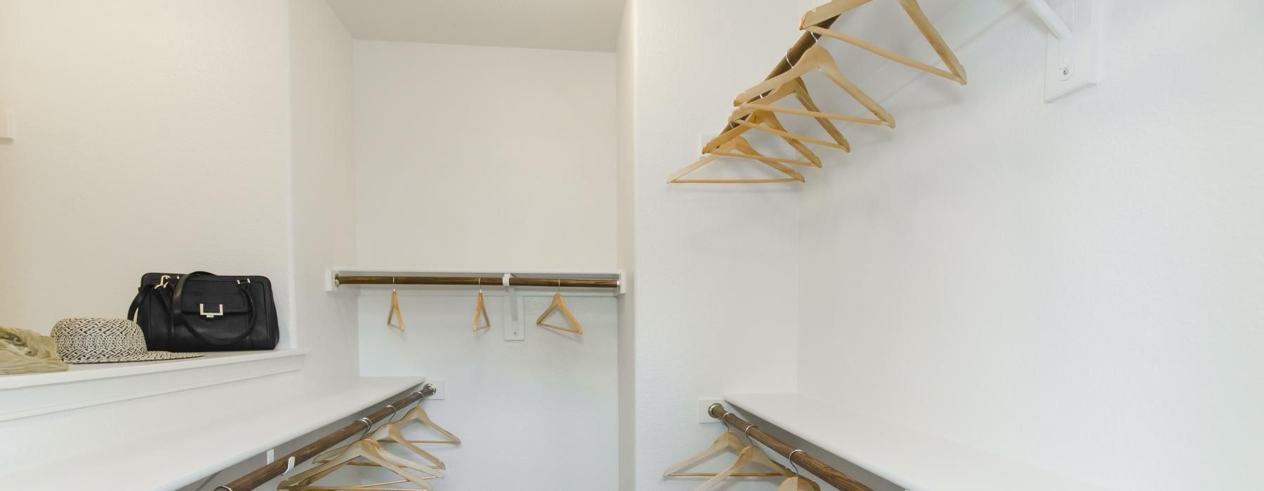 a closet with hangers