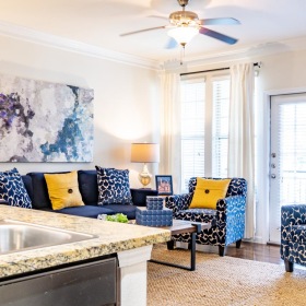 Spacious kitchens with thoughtful details a living room with a sink and a couch