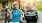 a woman holding a golf club